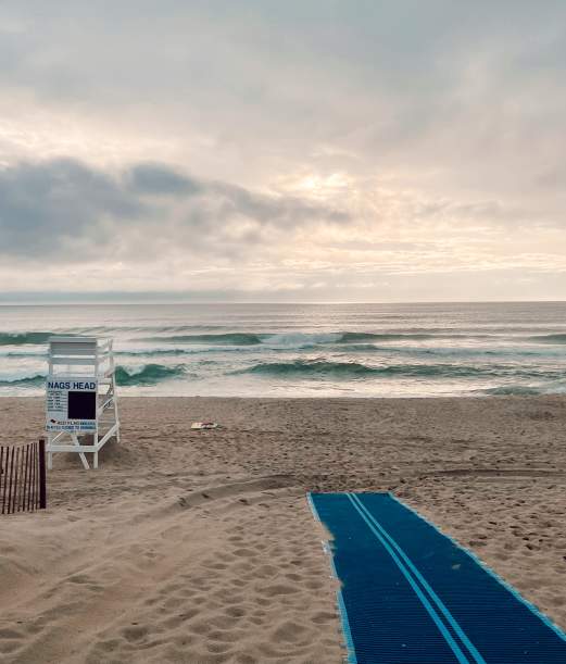 Nags Head beach on the Outer Banks showing the use of a Mobi Mat for handicapped accessibility.