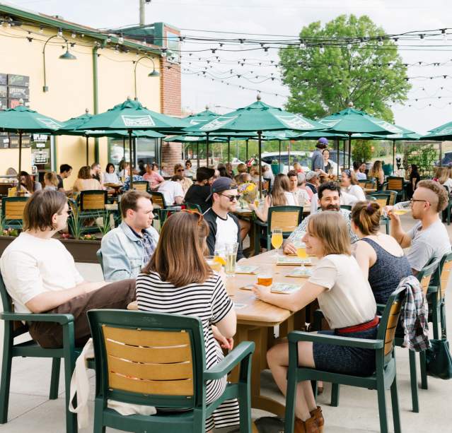 A large group dining on Upland's patio