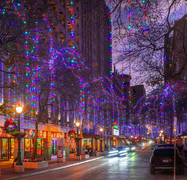 Street in San Antonio adorned with holiday lights and wreaths