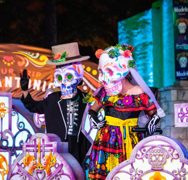Costumed catrina and catrino at River Parade