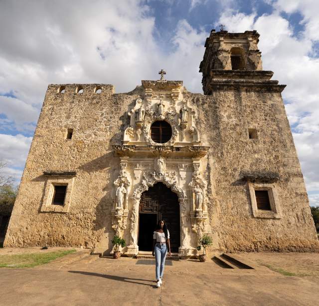 Woman walking away from Mission San Jose
