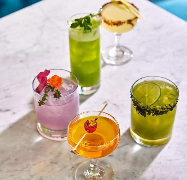 Assortment of cocktail drinks on table