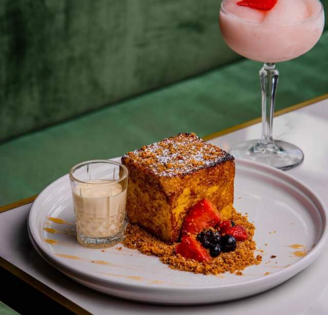 Pastry next to glass of sweet drink