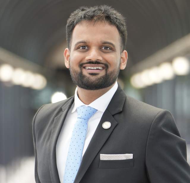 Neal Patel posing for a headshot.