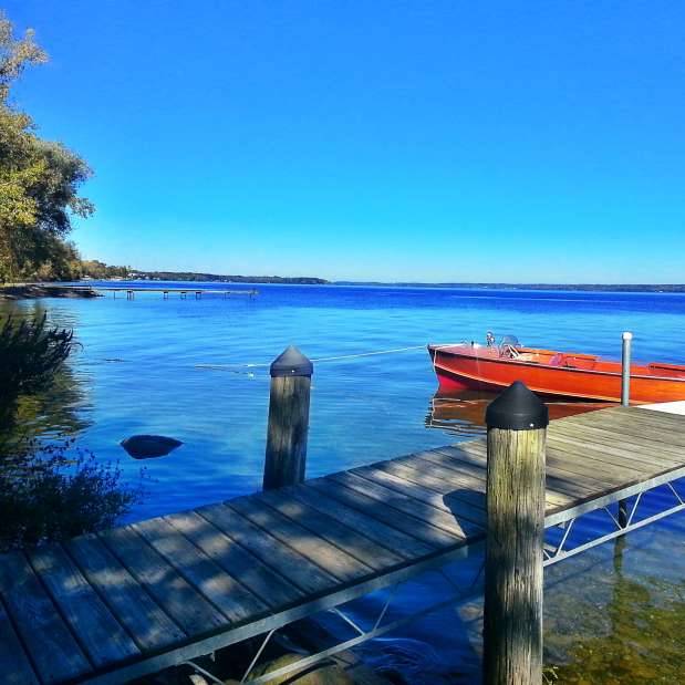 Dock with tied up boat on Cayuga Lake