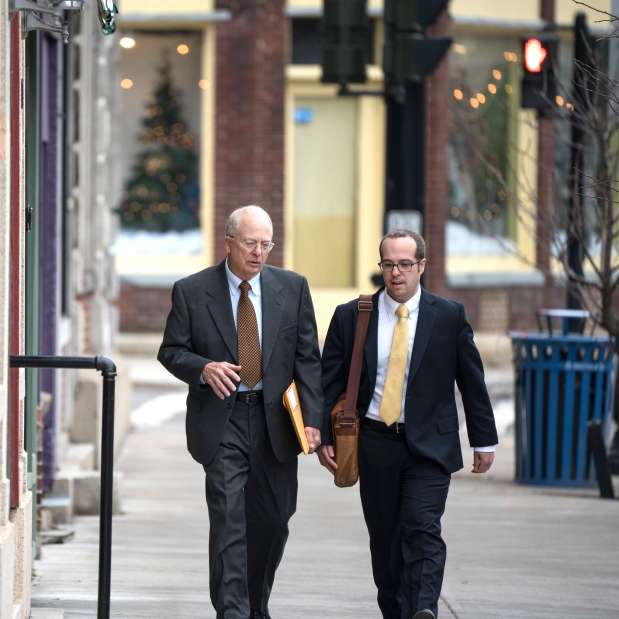 Two businessman walk in the Downtown district of Waterloo