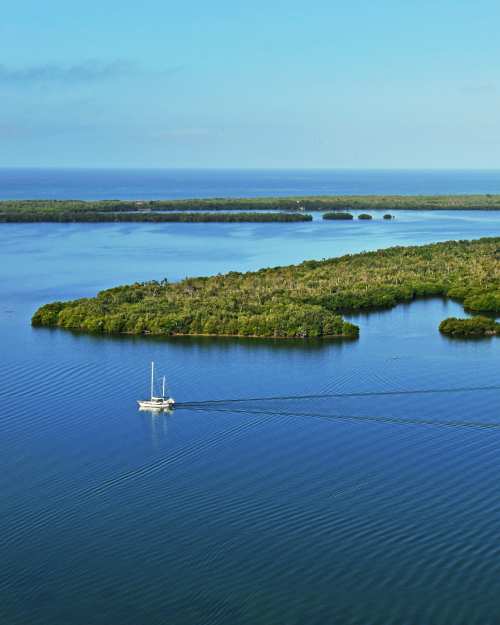 Sailboat gliding through the water off of Cabbage Key