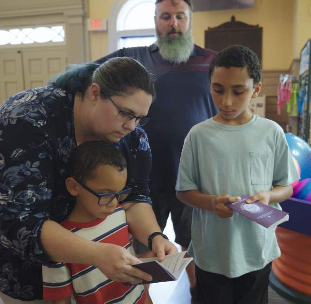 A family of four visit Fayetteville's Fascinate-U Children's Museum with their Cumberland County Destination Passport
