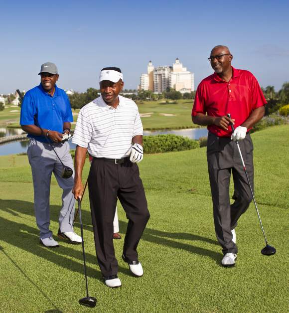 Three men golfing