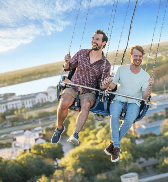 A gay couple riding the Orlando Starflyer at ICON Park
