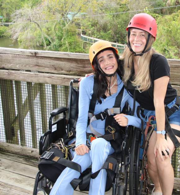 Accessibility influencer Amanda Perla experiences the Gator Gauntlet accessible zip line at Gatorland