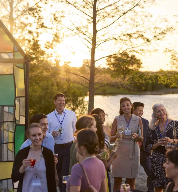 Meeting Planners mingle at the Glass House art installation in Lake Nona