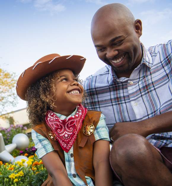 A father and daughter enjoy the EPCOT® International Flower & Garden Festival at WALT DISNEY WORLD® Resort in Orlando.