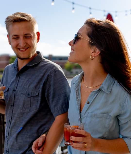 Couple walking outside of Waterfront Wine Bar in Manitowoc Wisconsin