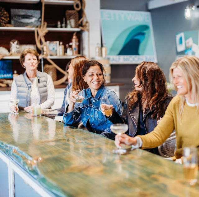 Women at the bar of Jettywave Distillery