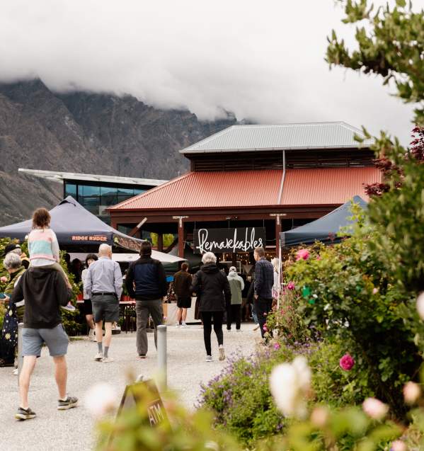 People walking into the Remarkables Market