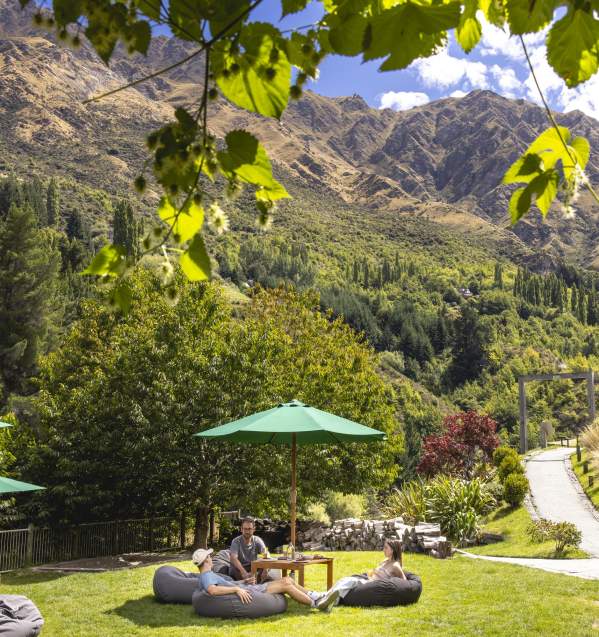 People relaxing in outdoor beer garden at Canyon Brewing