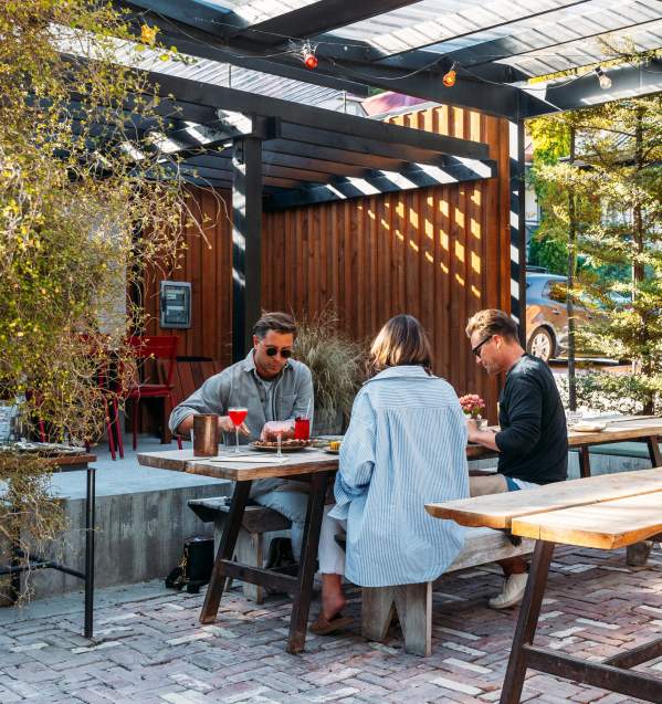 Group of people dining in an outdoor courtyard
