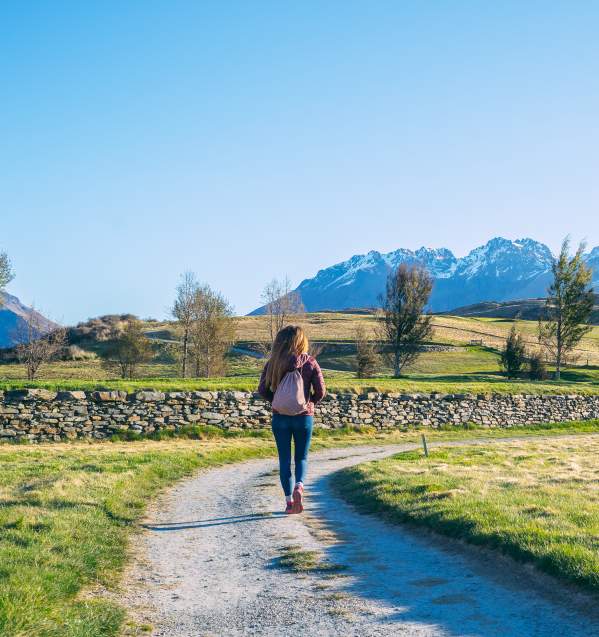 Woman taking a walk around Jacks Point in spring