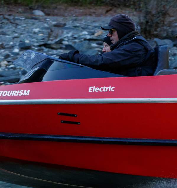 Person driving an electric jet boat prototype