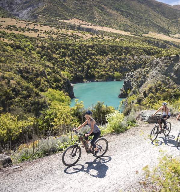 Friends biking the Gibbston River Trail, part of the Queenstown Trail network