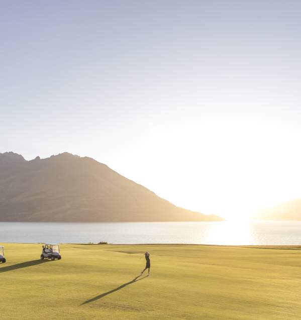 Golfer takes a swing at Jacks Point in summer