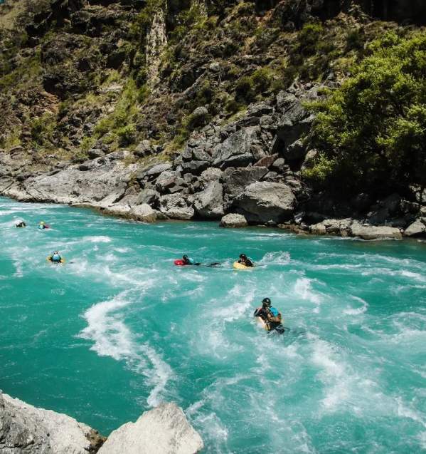 Group of people boarding down the river