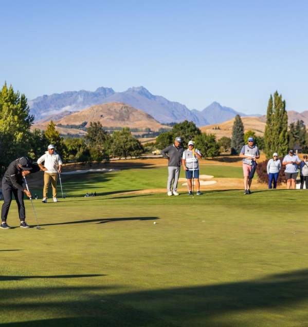 People putting on a golf green at the NZ Golf Open 2025, Millbrook Resort