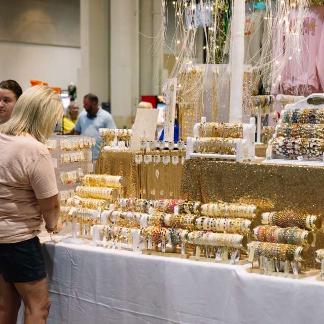 Woman shopping jewelry at Ron Meyers Christmas City