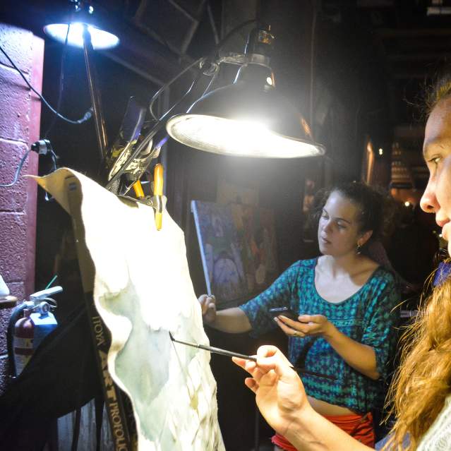 Woman paints at an event in San Marcos, Texas