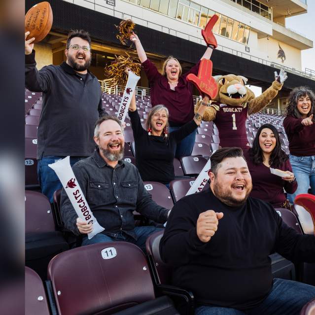 The San Marcos Destination Services team get rowdy at a Texas State University game