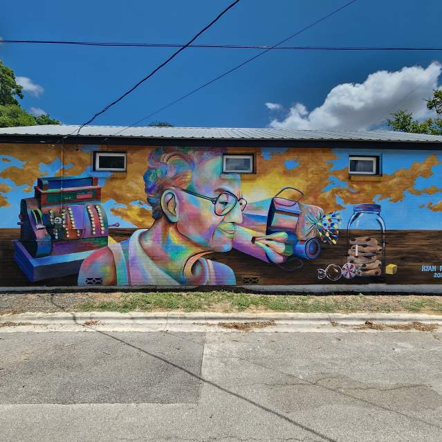 A parking lot view of Ms Ollie's Mural in the Dunbar neighborhood in San Marcos, Texas