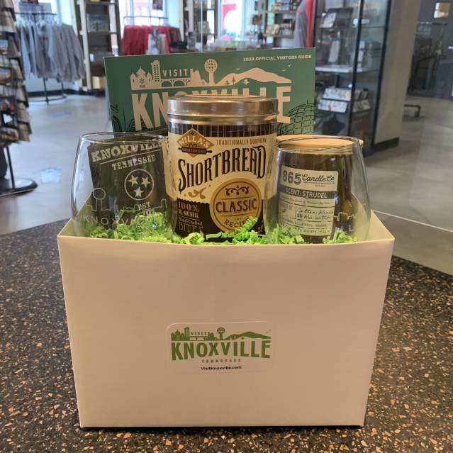 Visit Knoxville Gift Box with wine glasses, shortbread, and candles