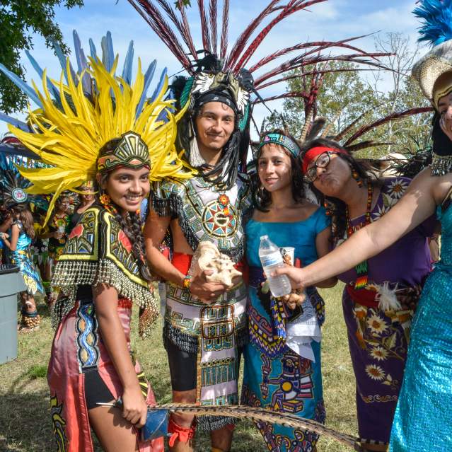 Dancers pose at the Sacred Springs Powwow held at Spring Lake in San Marcos, Texas