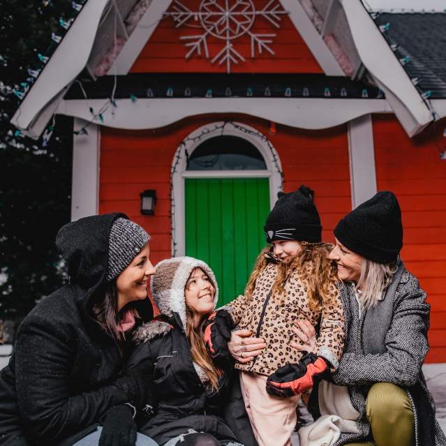 family having winter fun outside