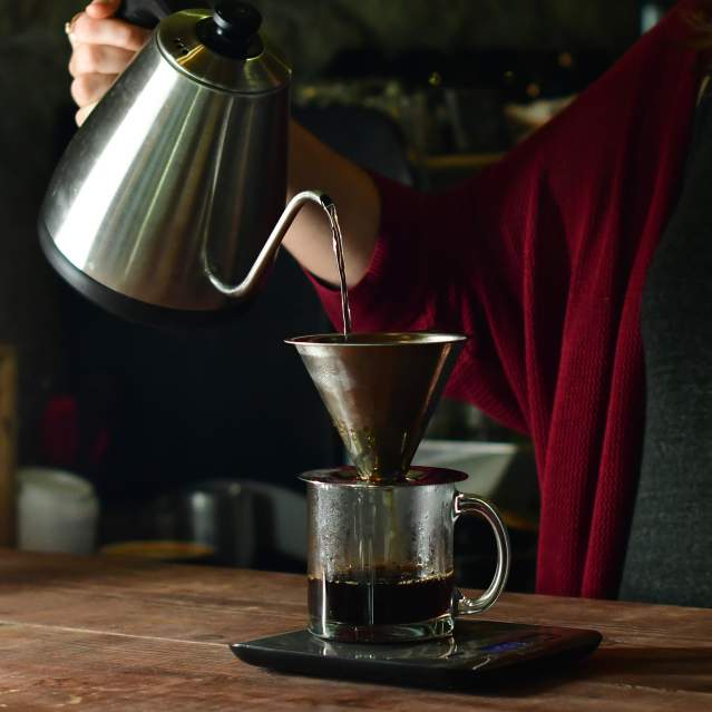 Barista making coffee pour-over