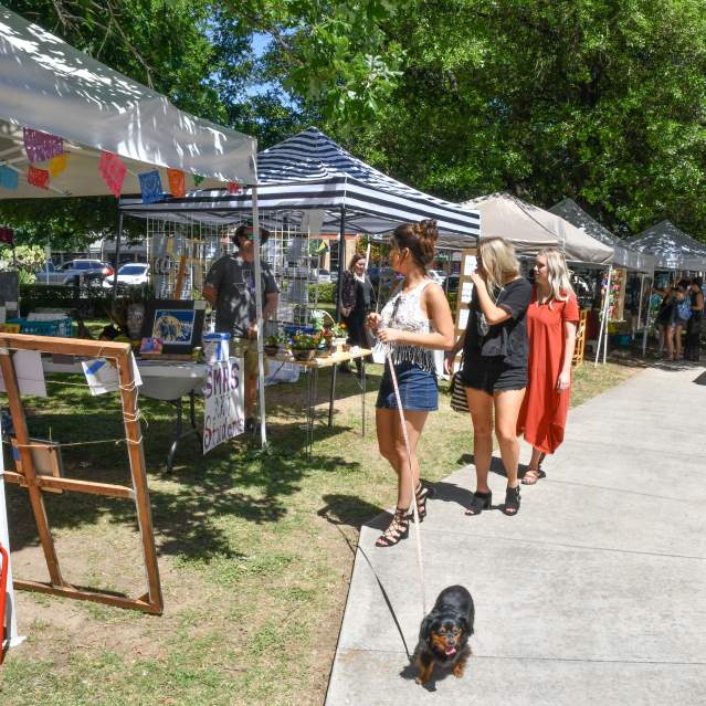 Crowd and vendors at art market