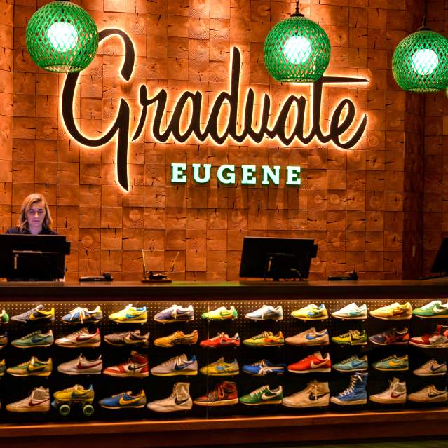 Running Shoe Front Desk at the Graduate Eugene Hotel by Melanie Griffin