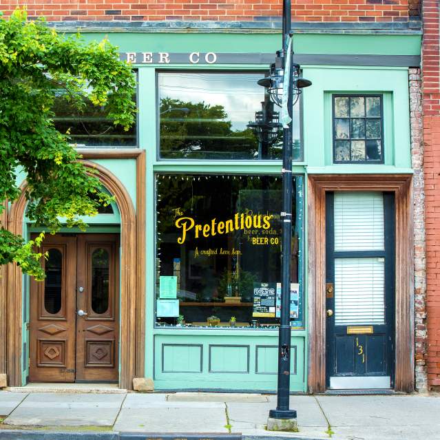 Store front of Pretentious Beer Co in the Old City neighborhood of Knoxville