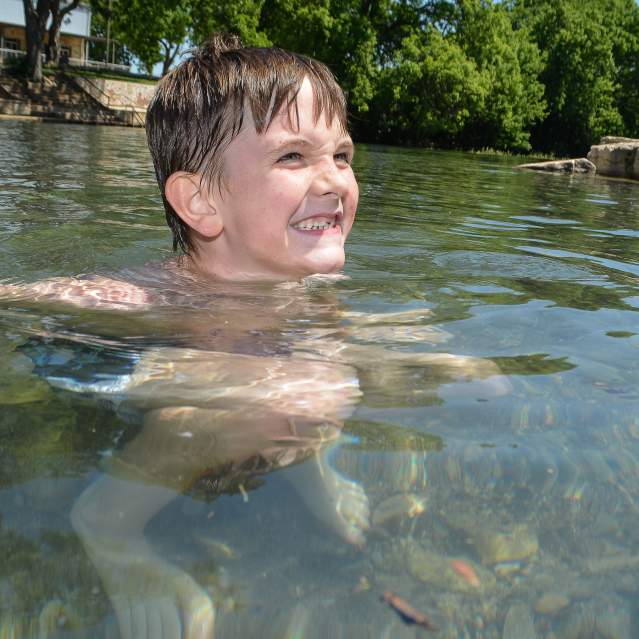 Young boy in river