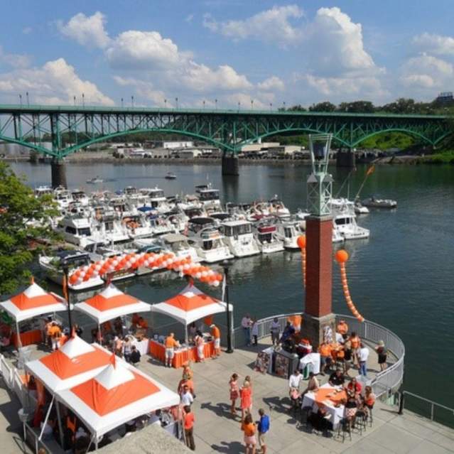 Vol Navy Boat Dock with orange and white tents for UT tailgate