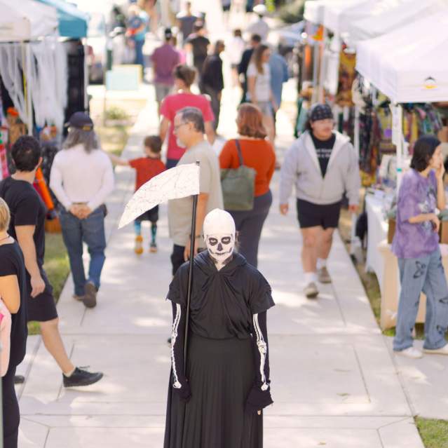 A grim reaper is dressed up and ready to shop at Art Squared in Downtown San Marcos