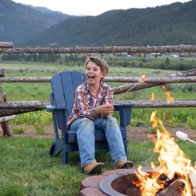 Family enjoying smores around a campfire