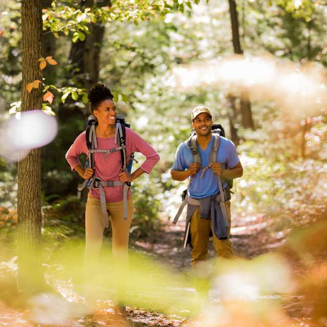 Couple with backpacks hiking the Appalachian Trail