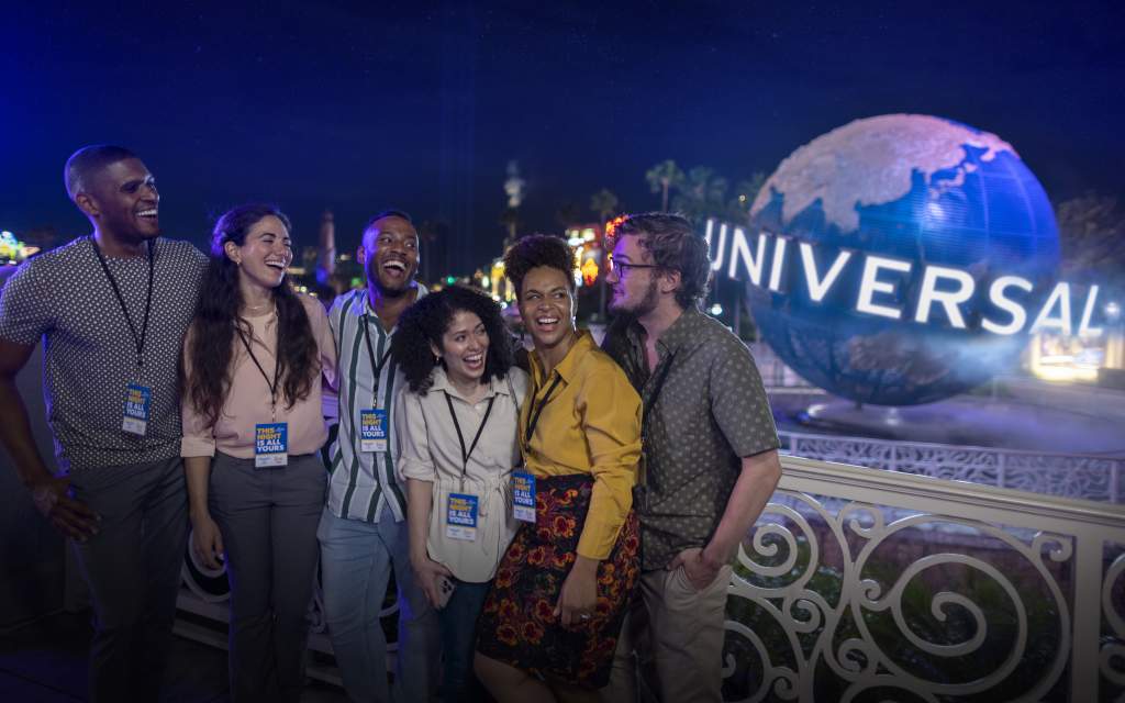 Group for meeting at Universal Orlando Resort by globe at night