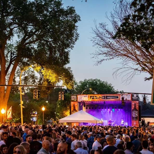 crowd of people and stage with purple lights