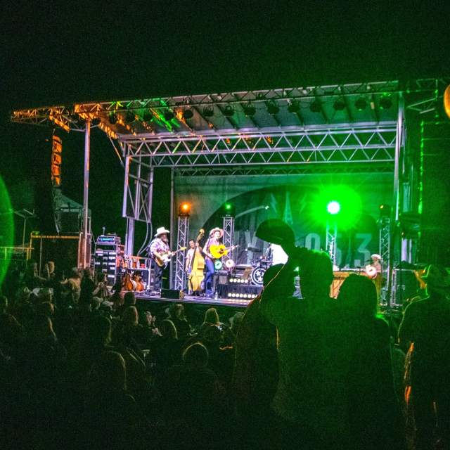 Texas Music Revolution_band on main stage_green light