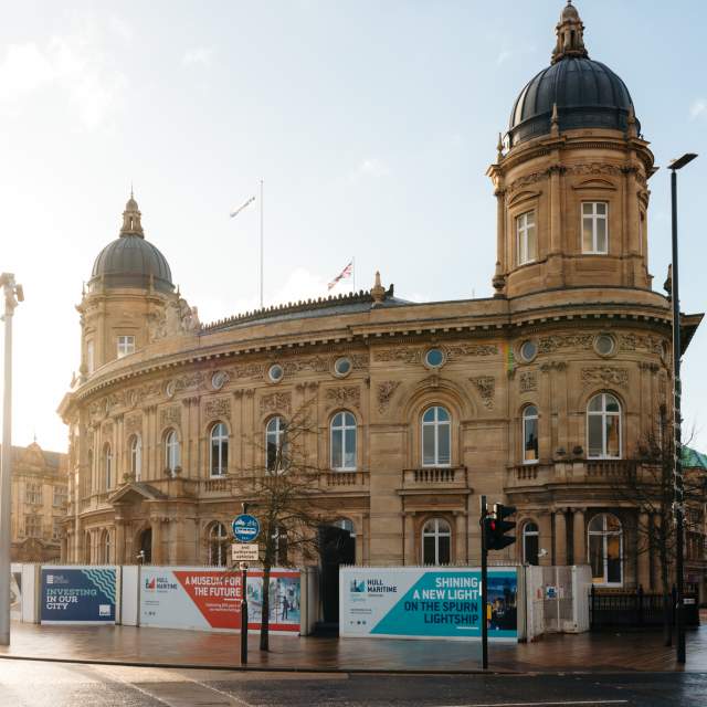 Hull Maritime Museum exterior with ornate historic architecture and colourful flower displays on a sunny day
