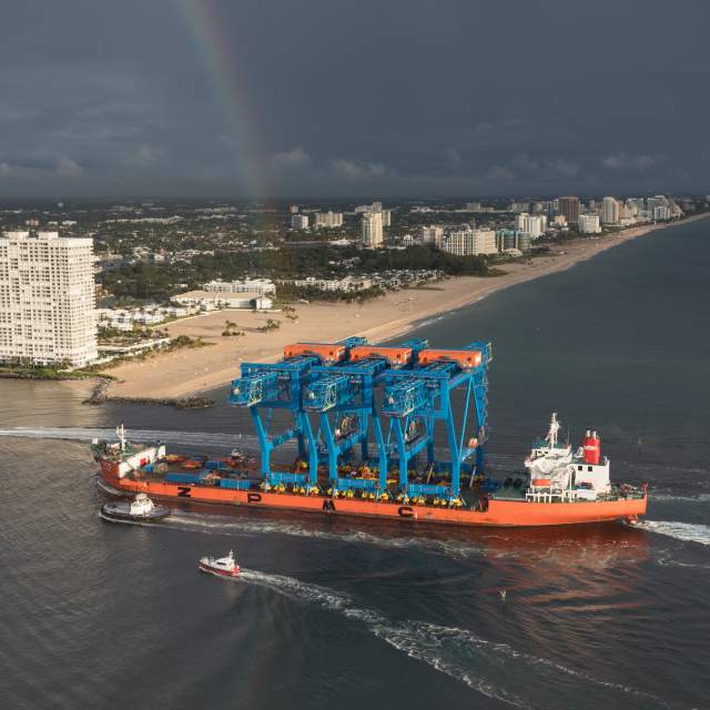 Cargo ship carries three Super-Post Panamax container gantry cranes in Port Everglades.