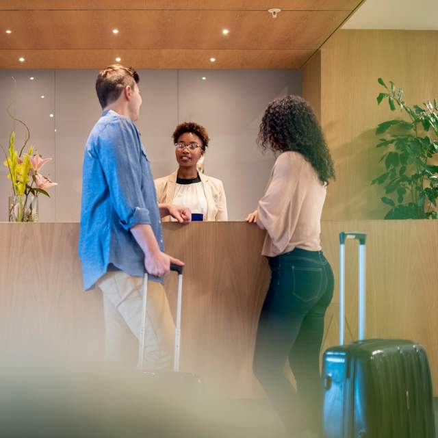 Couple checking into a hotel